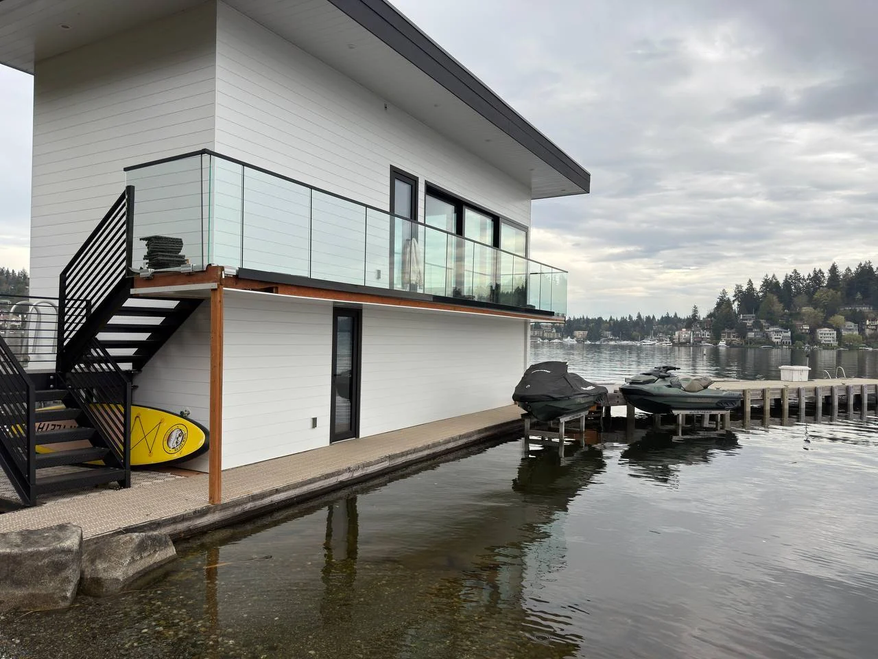 Waterfront residence with a glass balcony railing